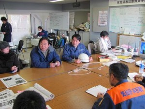 Peace Winds Japan staff meet with personnel at the Kesennuma disaster response headquarters.